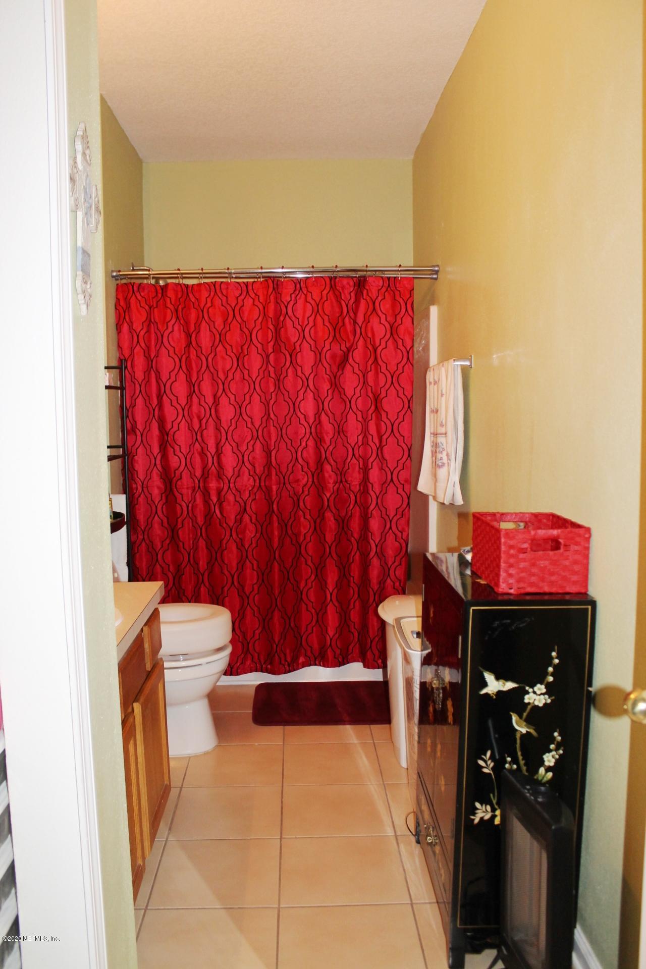 3680 Kirkpatrick Circle, Unit 3 Jacksonville, FL 32210 - Photo 25 of 29 a view of a room with furniture and a window