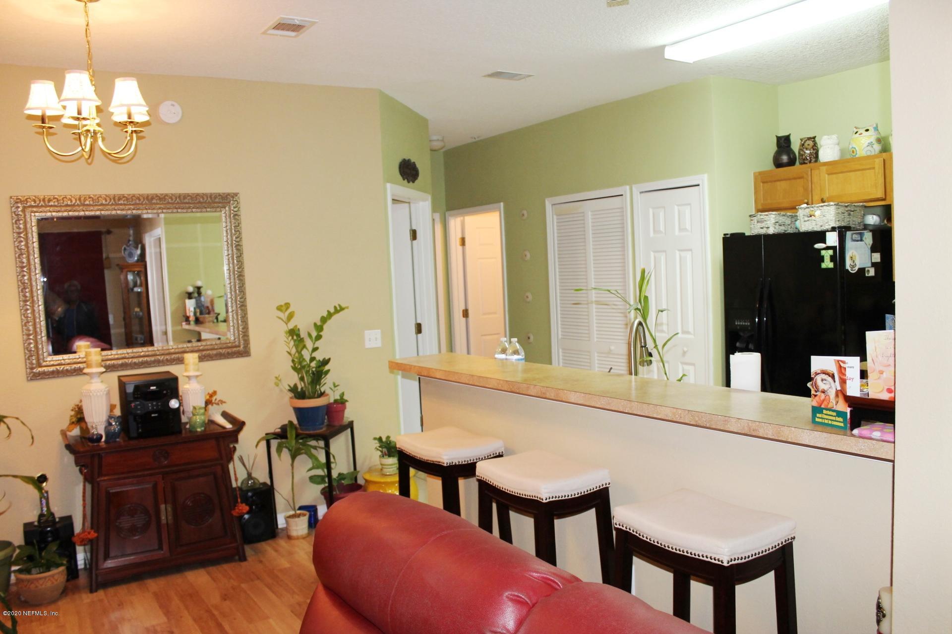 3680 Kirkpatrick Circle, Unit 3 Jacksonville, FL 32210 - Photo 6 of 29 a bathroom with a sink vanity and a mirror