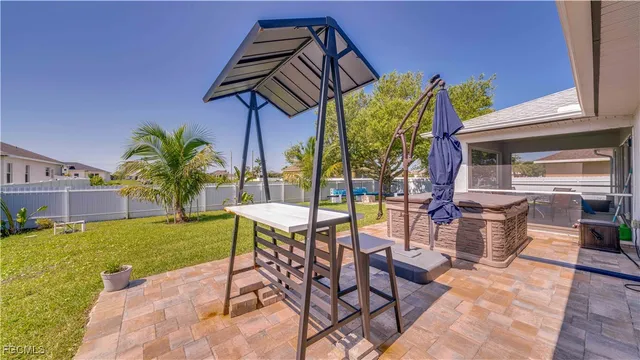 a view of an outdoor dining space with a patio