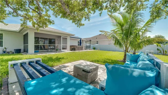 a view of a house with a backyard