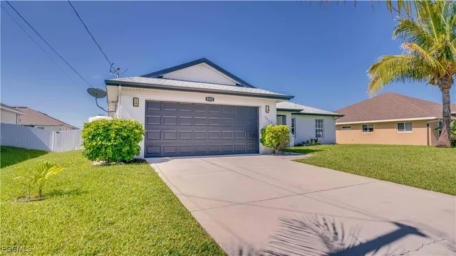 a front view of a house with garden