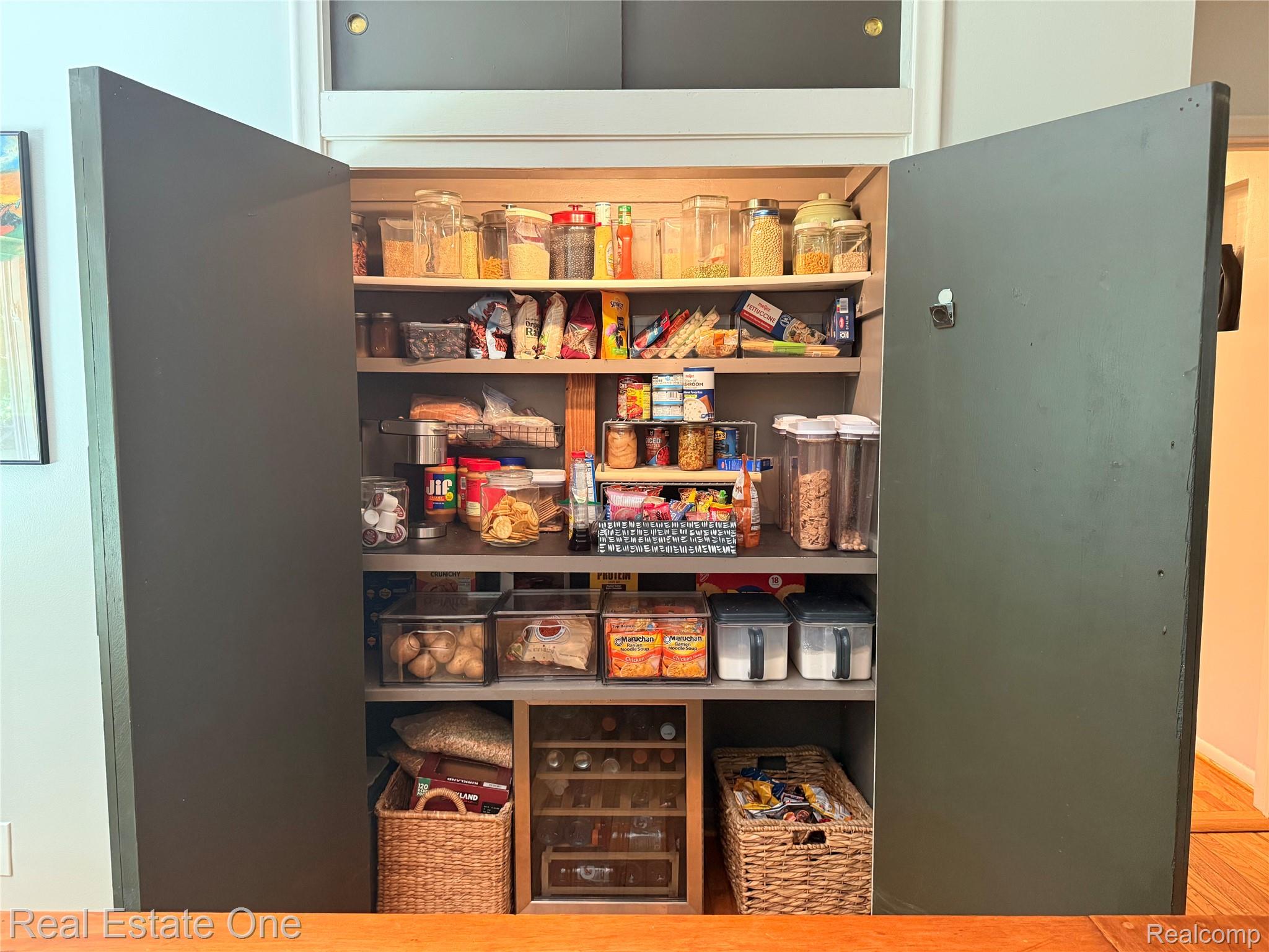2189 Devonshire Road Bloomfield Hills, MI 48302 - Photo 18 of 50 Custom-built pantry with dark-finish doors and varied shelving