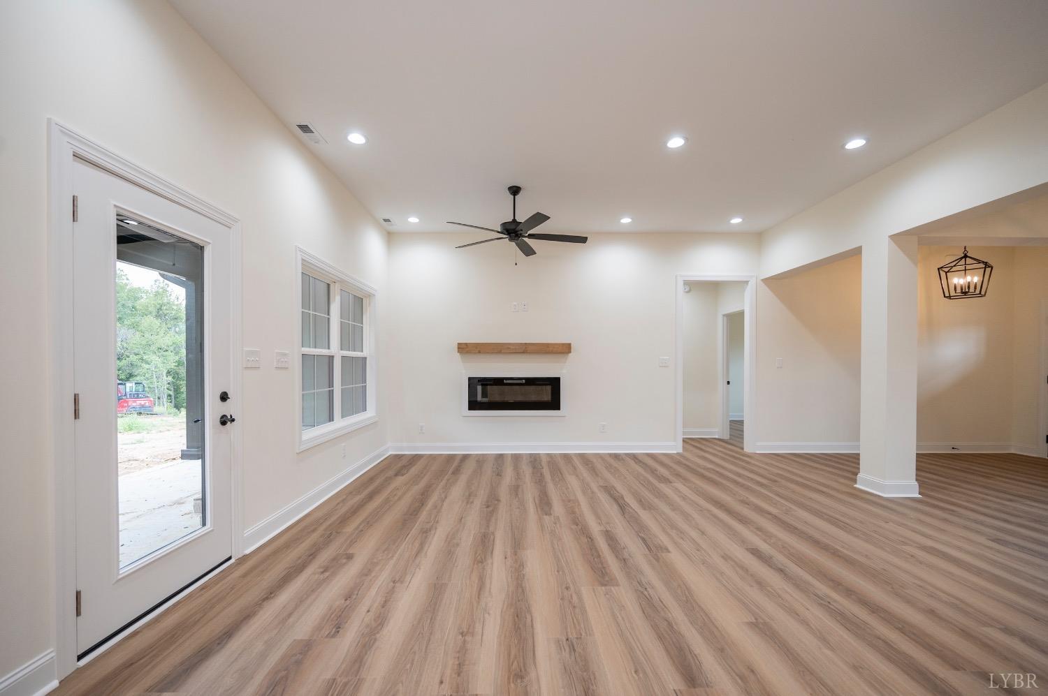 1738 Willow Oak Drive Forest, VA 24551 - Photo 12 of 54 a view of an empty room with a window and wooden floor