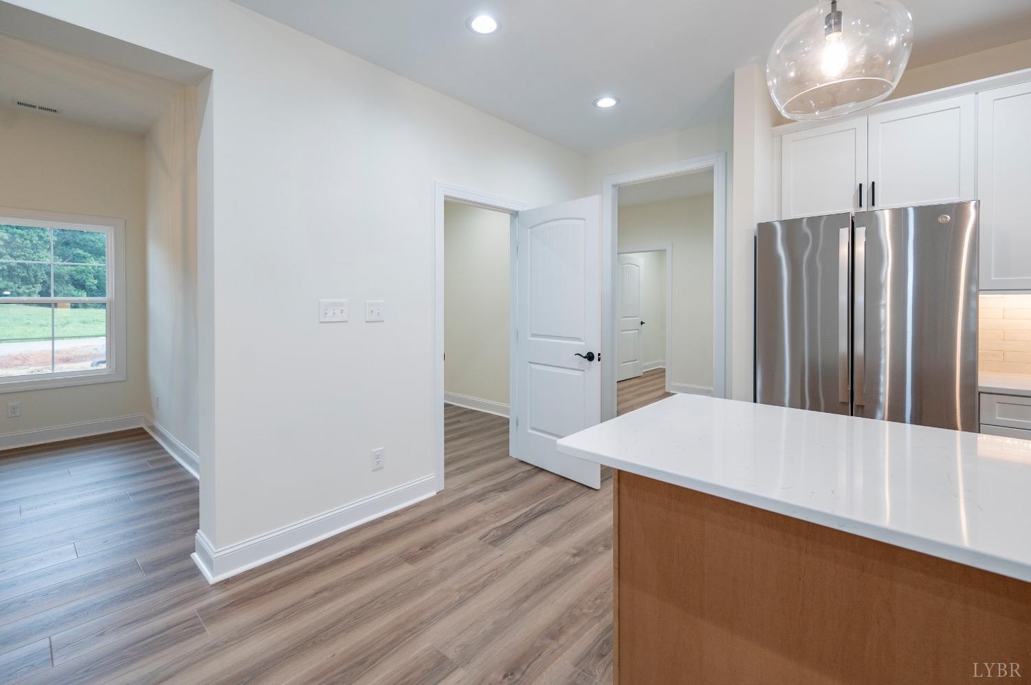 1738 Willow Oak Drive Forest, VA 24551 - Photo 14 of 54 a kitchen with stainless steel appliances a refrigerator and wooden floor