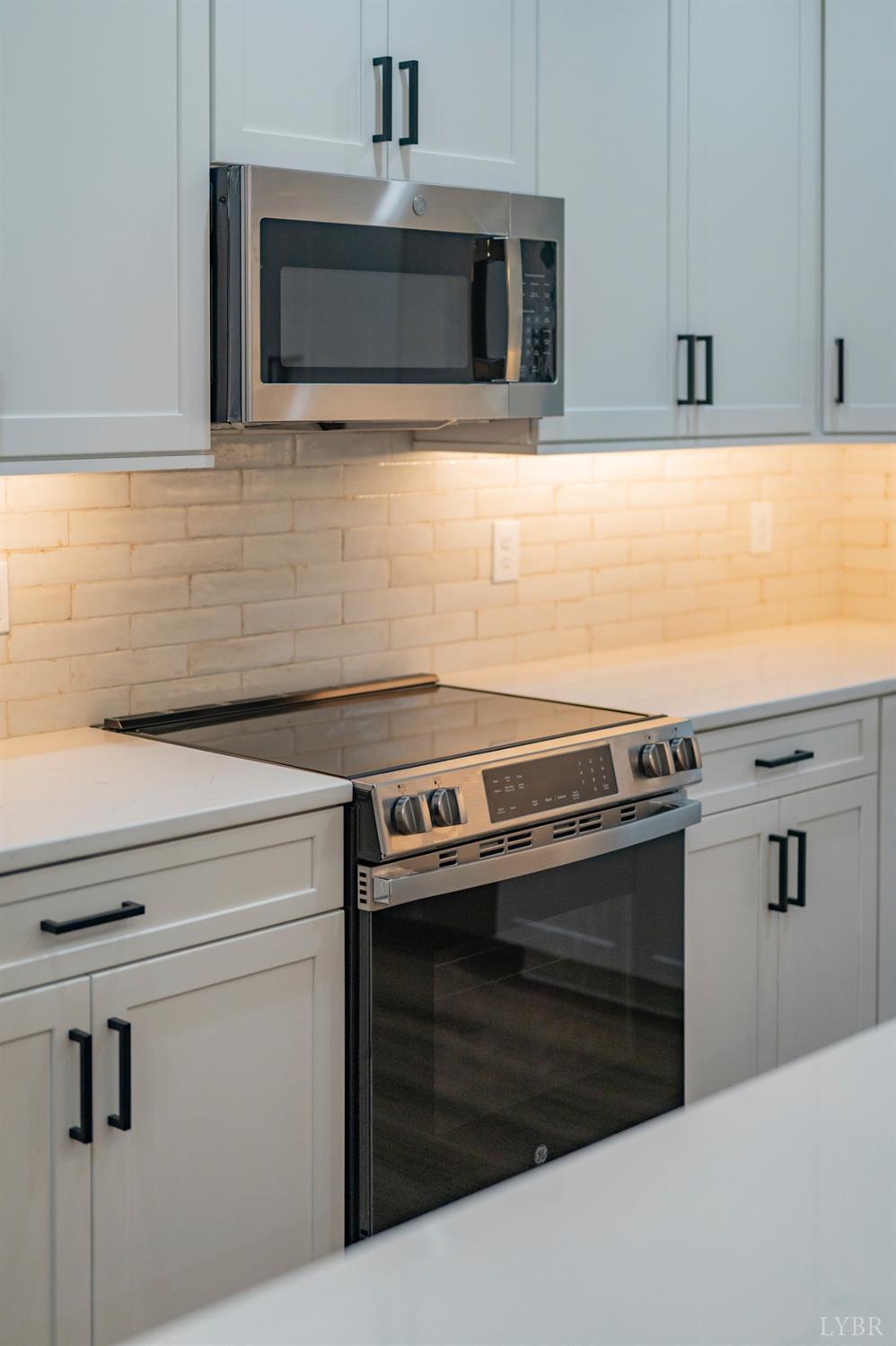 1738 Willow Oak Drive Forest, VA 24551 - Photo 15 of 54 a stove top oven sitting inside of a kitchen