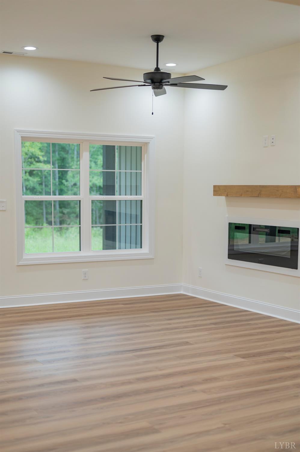 1738 Willow Oak Drive Forest, VA 24551 - Photo 23 of 54 a view of an empty room with wooden floor and a window