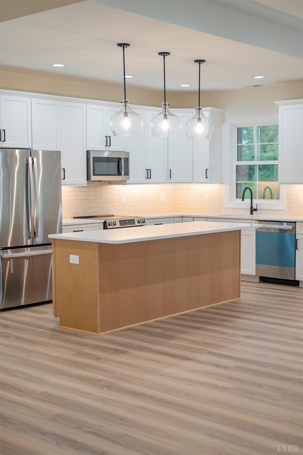 1738 Willow Oak Drive Forest, VA 24551 - Photo 24 of 54 a kitchen with stainless steel appliances granite countertop a sink a counter space and cabinets