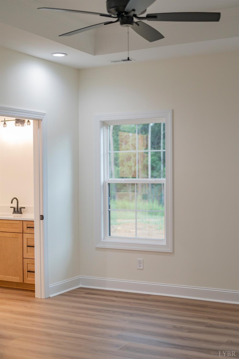 1738 Willow Oak Drive Forest, VA 24551 - Photo 29 of 54 an empty room with wooden floor cabinet and windows
