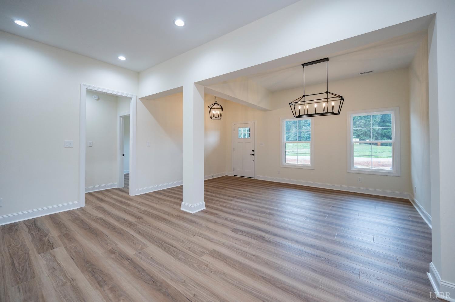 1738 Willow Oak Drive Forest, VA 24551 - Photo 3 of 54 an empty room with wooden floor chandelier and windows