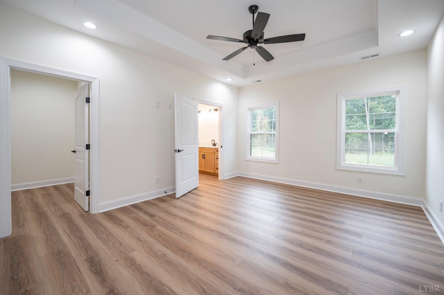 1738 Willow Oak Drive Forest, VA 24551 - Photo 31 of 54 a view of a livingroom with wooden floor and a ceiling fan