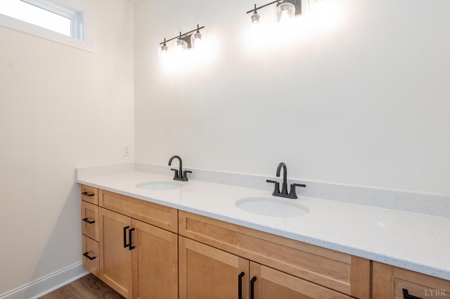 1738 Willow Oak Drive Forest, VA 24551 - Photo 36 of 54 a bathroom with a sink and a mirror