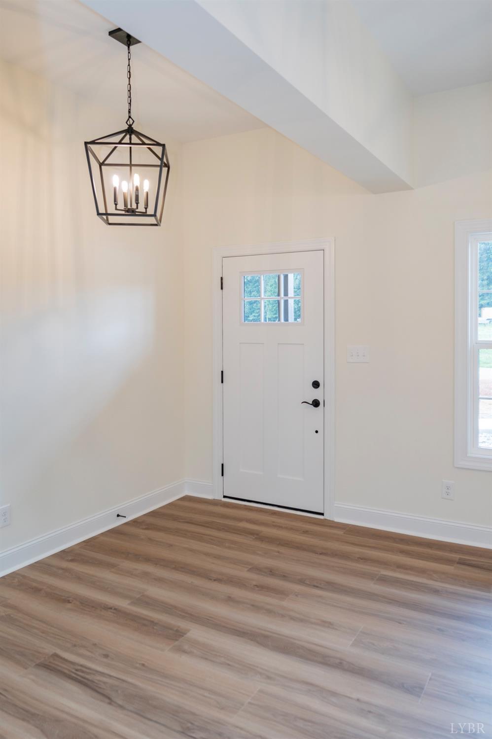 1738 Willow Oak Drive Forest, VA 24551 - Photo 4 of 54 a view of a room with wooden floor and white walls