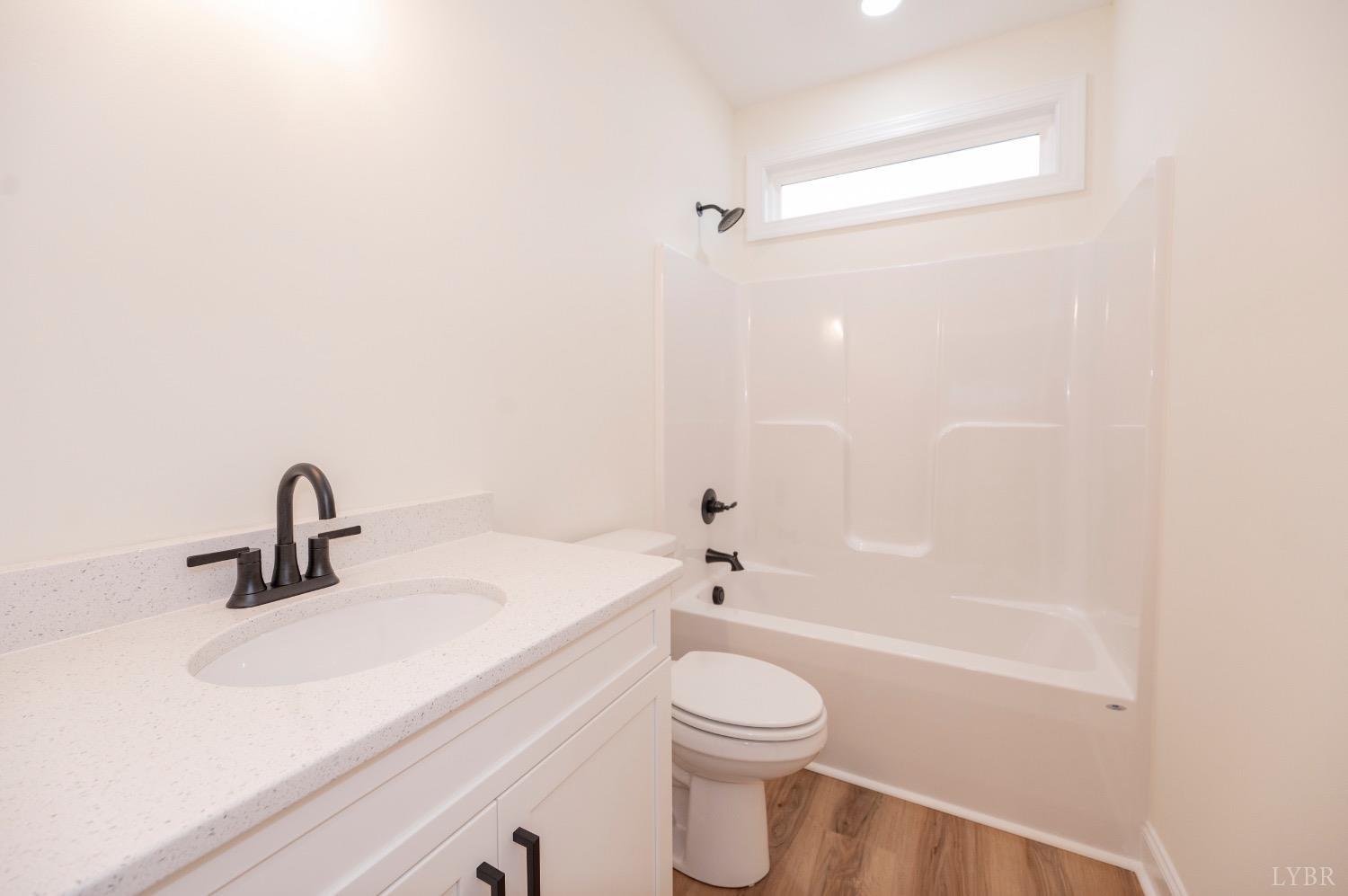 1738 Willow Oak Drive Forest, VA 24551 - Photo 46 of 54 a bathroom with a sink a toilet and shower