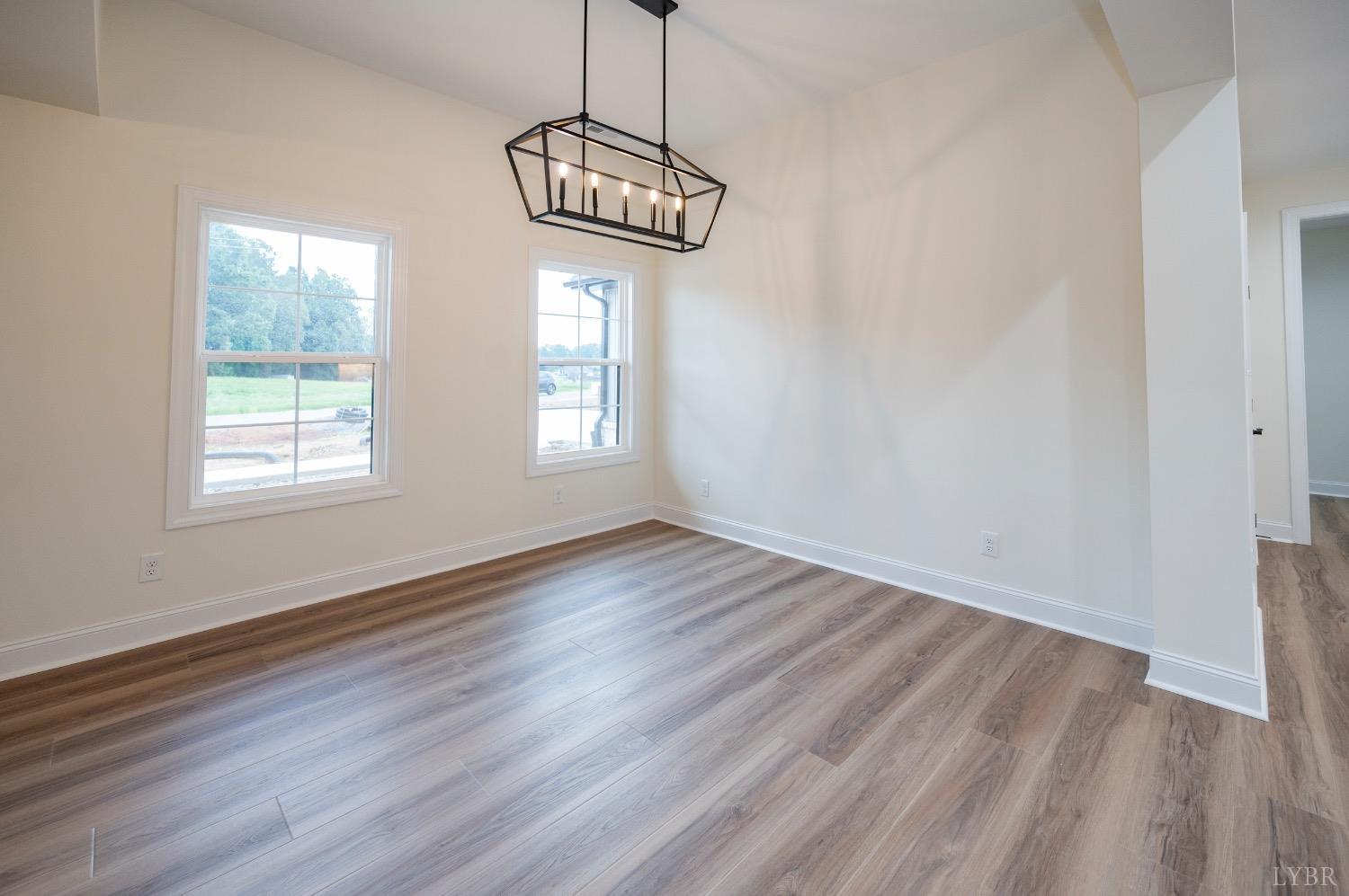 1738 Willow Oak Drive Forest, VA 24551 - Photo 5 of 54 a view of an empty room with wooden floor and a window