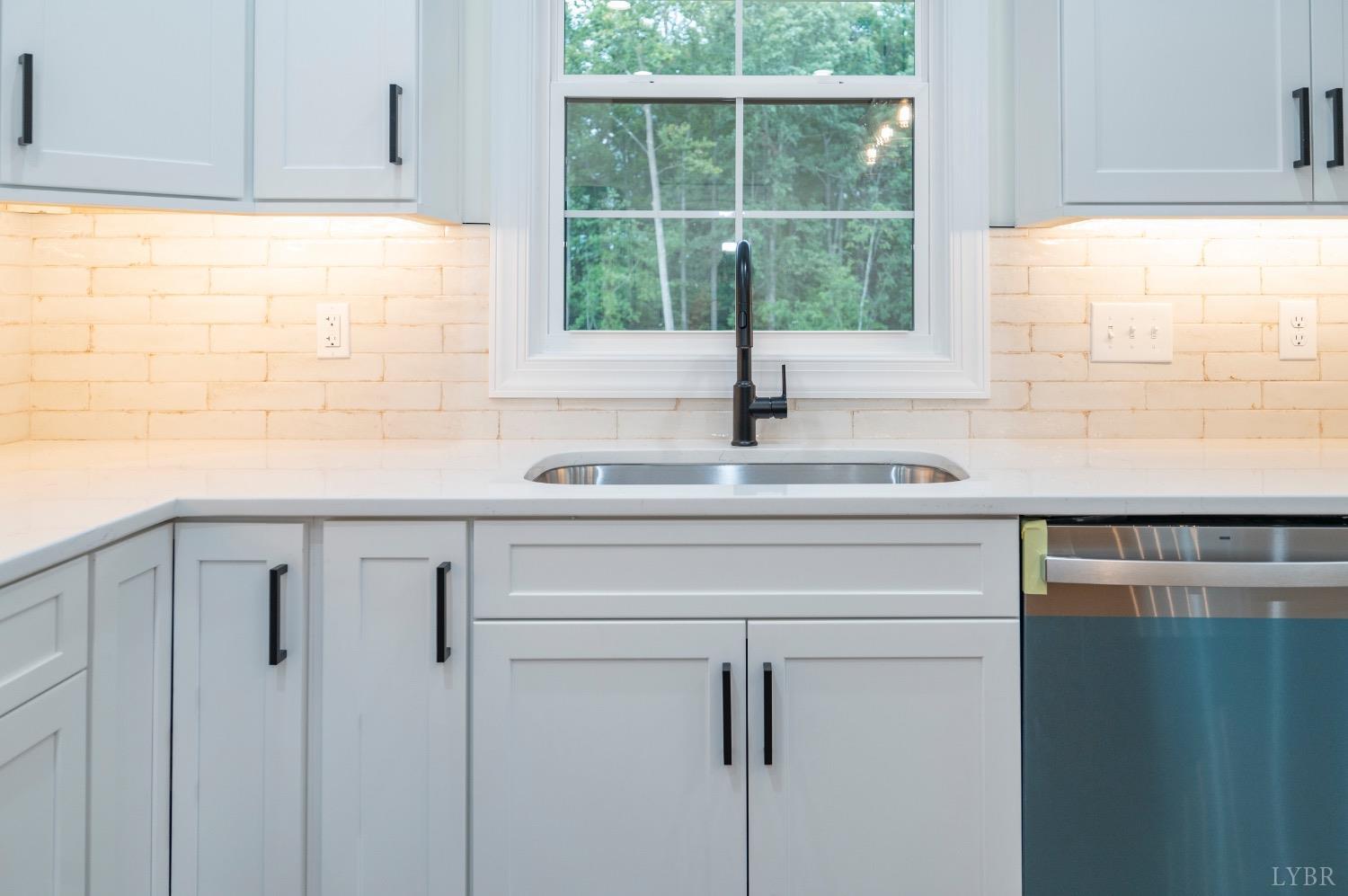 1738 Willow Oak Drive Forest, VA 24551 - Photo 9 of 54 a view white kitchen with sink window and refrigerator