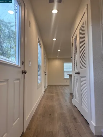 a kitchen with kitchen island a counter top space appliances and a sink