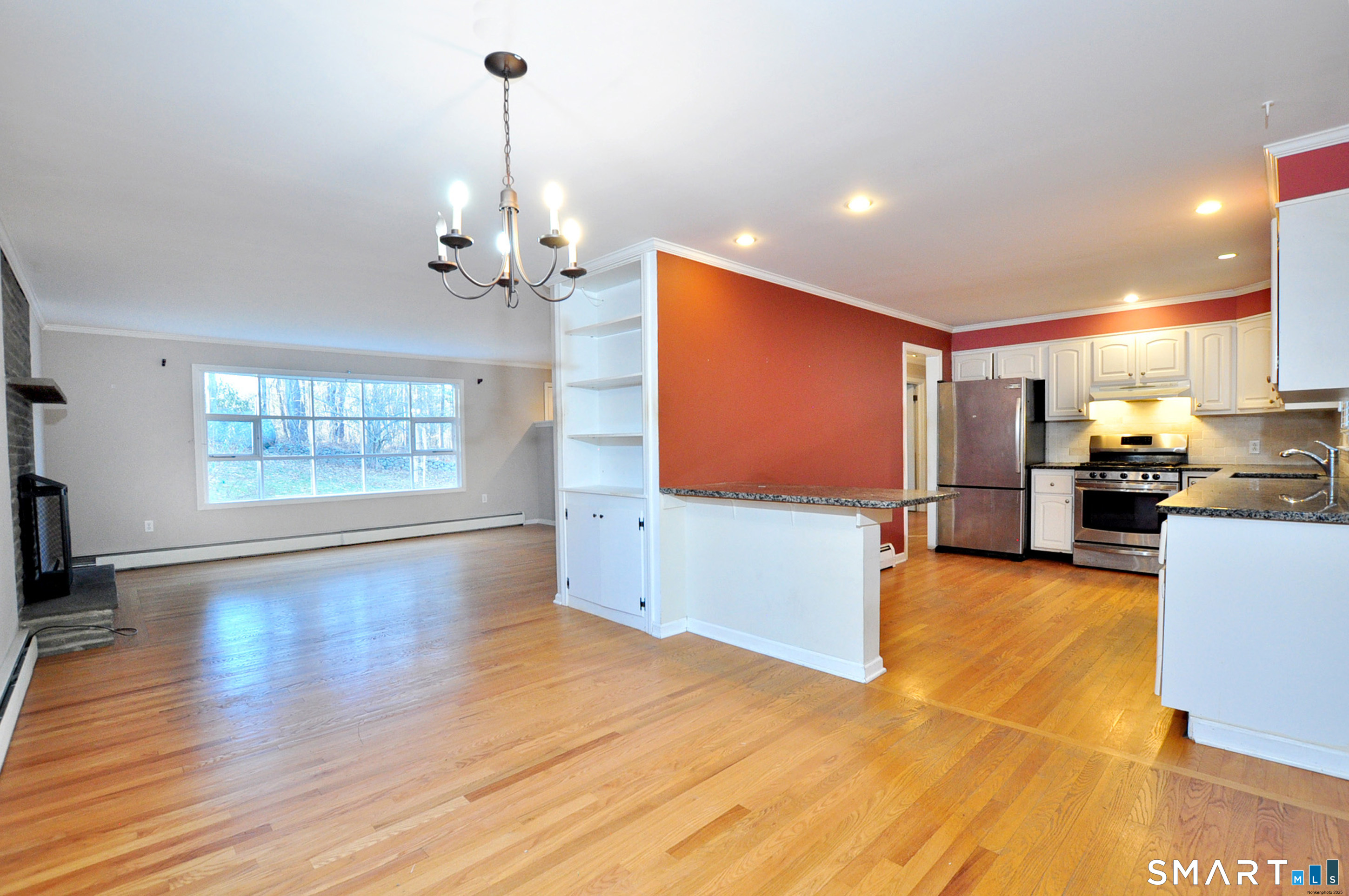 204 Goodhouse Road Litchfield, CT 06759 - Photo 16 of 37 a view of a kitchen with furniture a ceiling fan and wooden floor