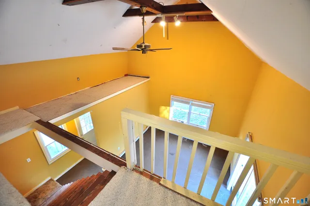 a view of a balcony with wooden floor