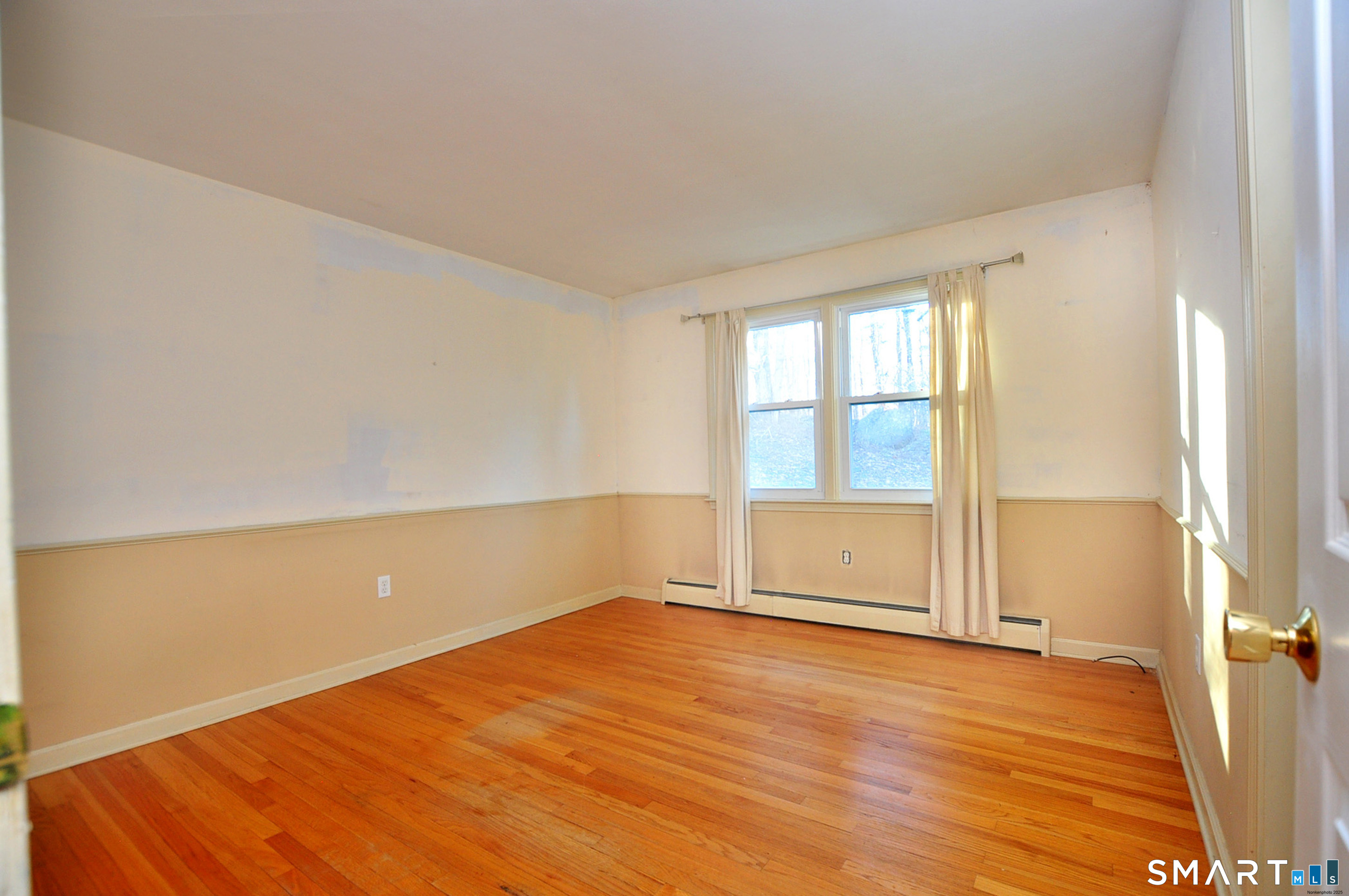 204 Goodhouse Road Litchfield, CT 06759 - Photo 29 of 37 an empty room with wooden floor and windows