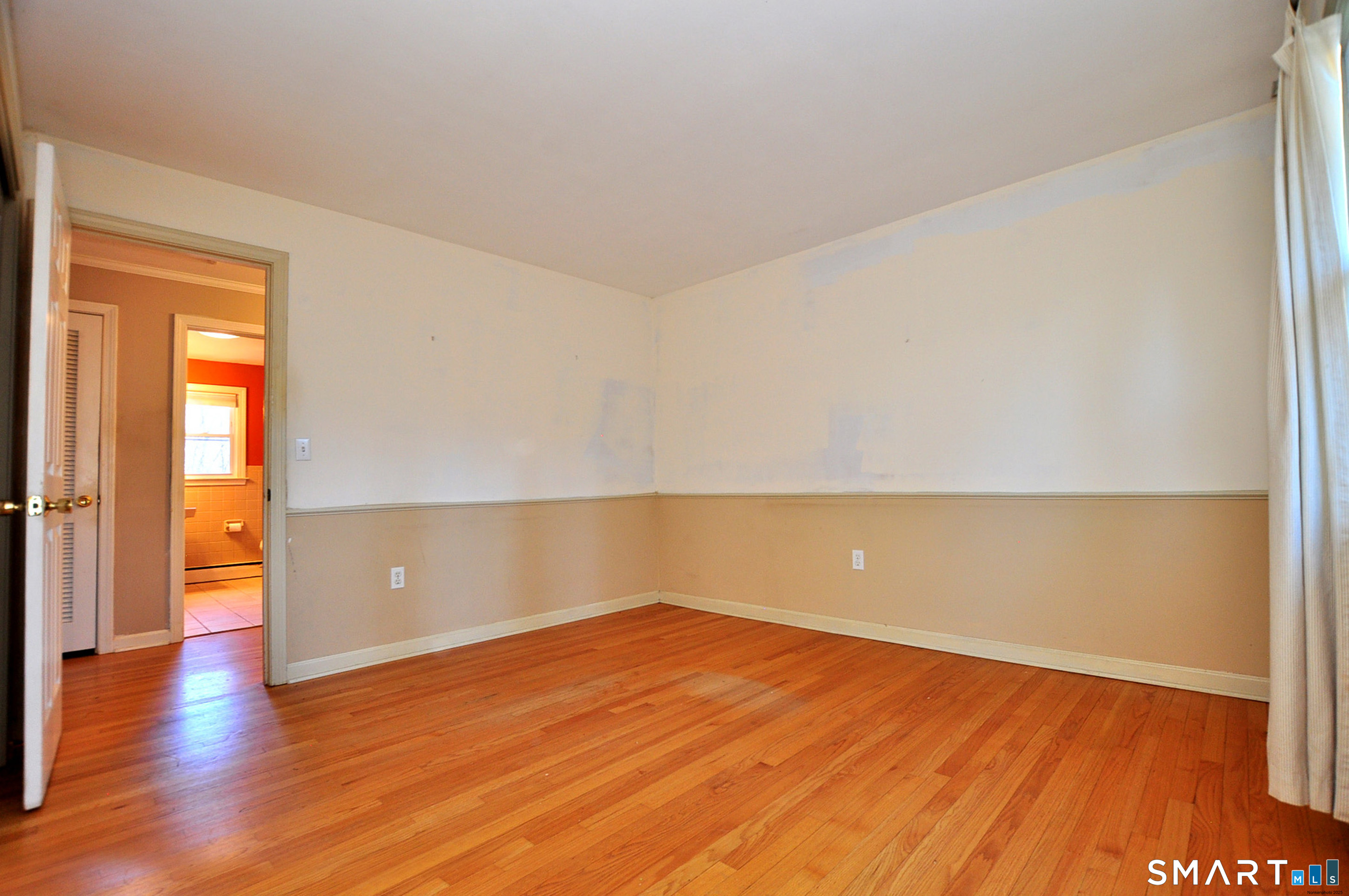 204 Goodhouse Road Litchfield, CT 06759 - Photo 30 of 37 a view of an empty room with wooden floor and a window
