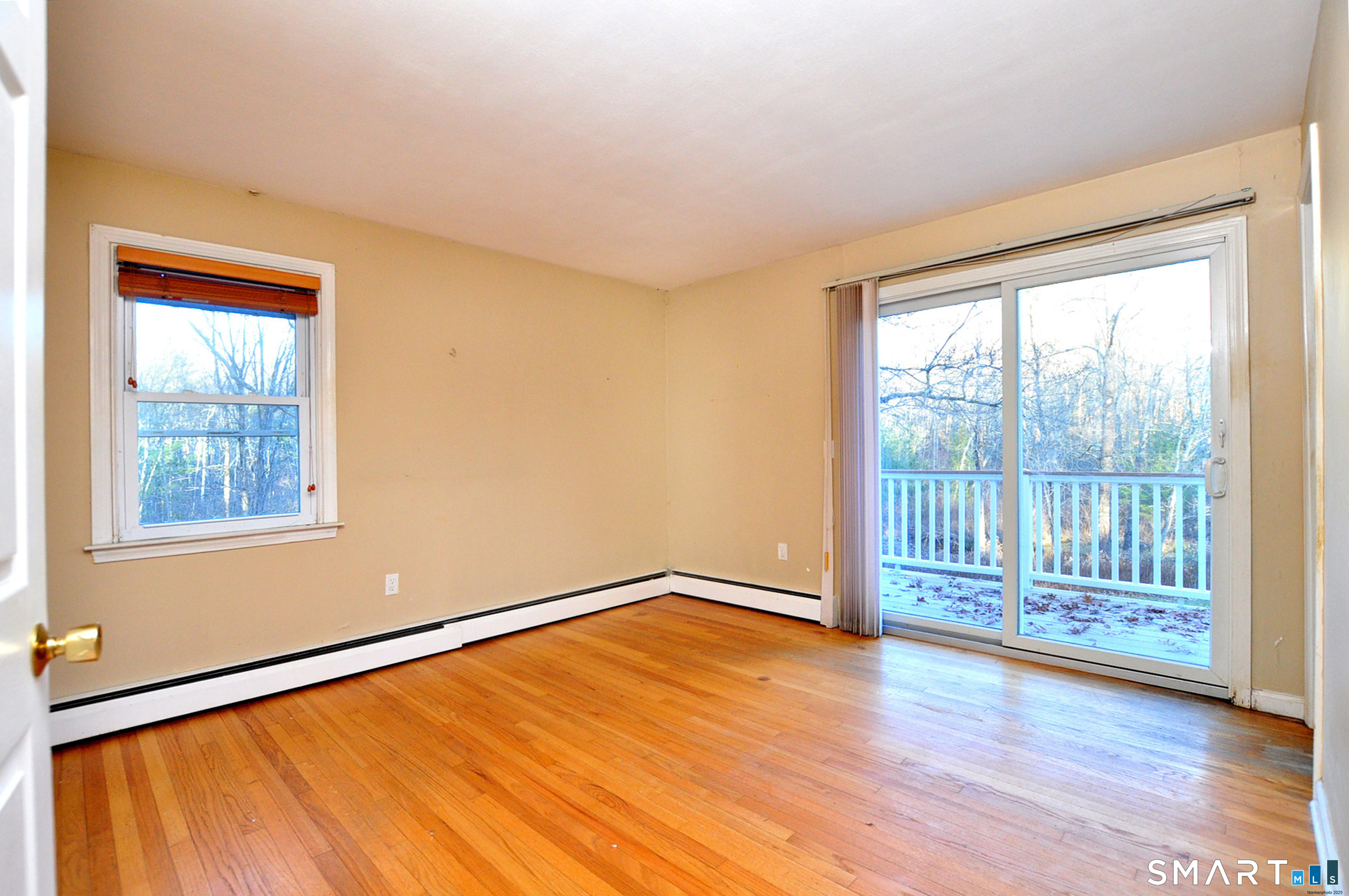 204 Goodhouse Road Litchfield, CT 06759 - Photo 33 of 37 a view of an empty room with wooden floor and a window