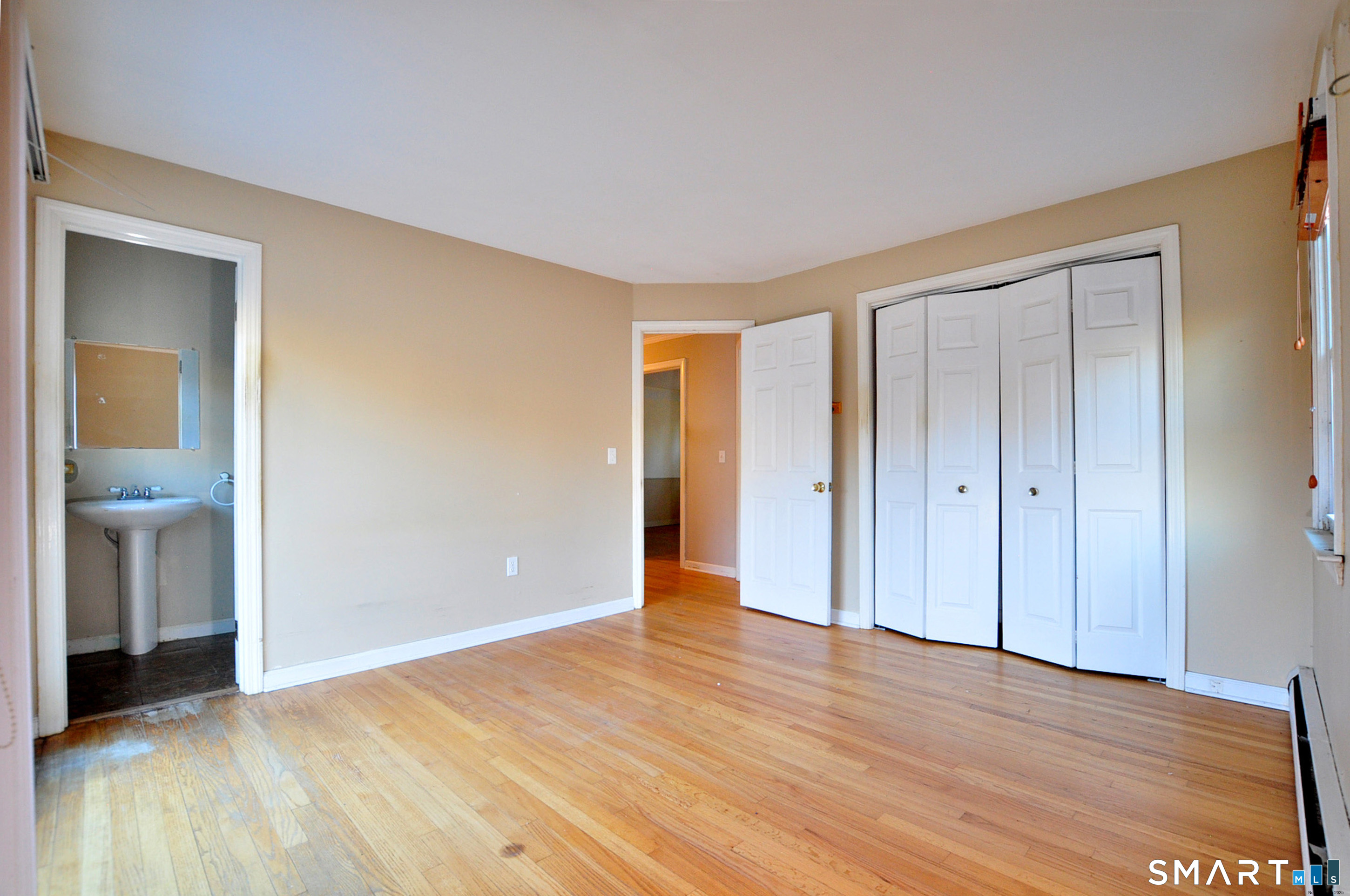 204 Goodhouse Road Litchfield, CT 06759 - Photo 34 of 37 a view of an empty room with wooden floor