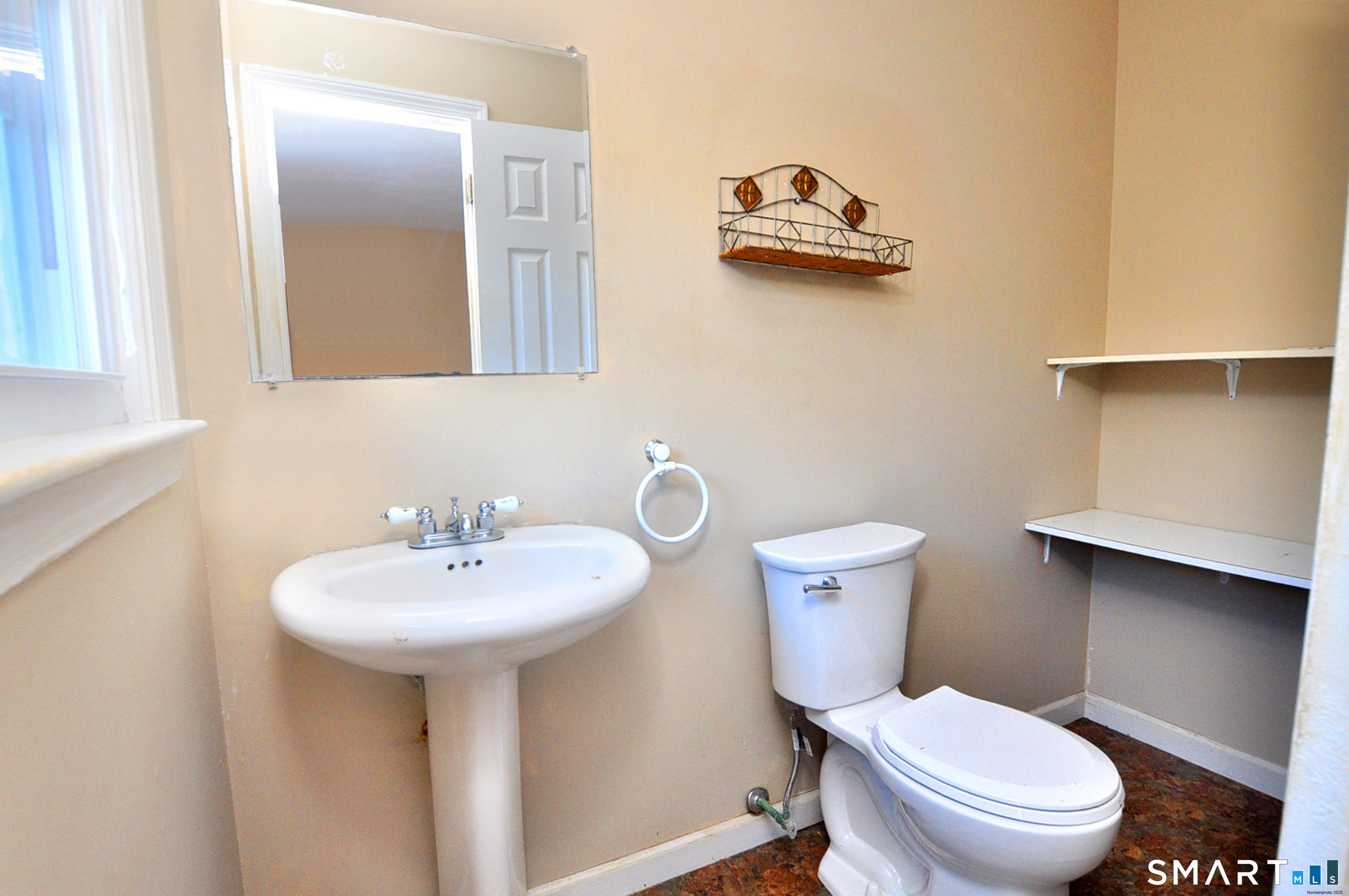 204 Goodhouse Road Litchfield, CT 06759 - Photo 35 of 37 a bathroom with a sink a toilet and mirror