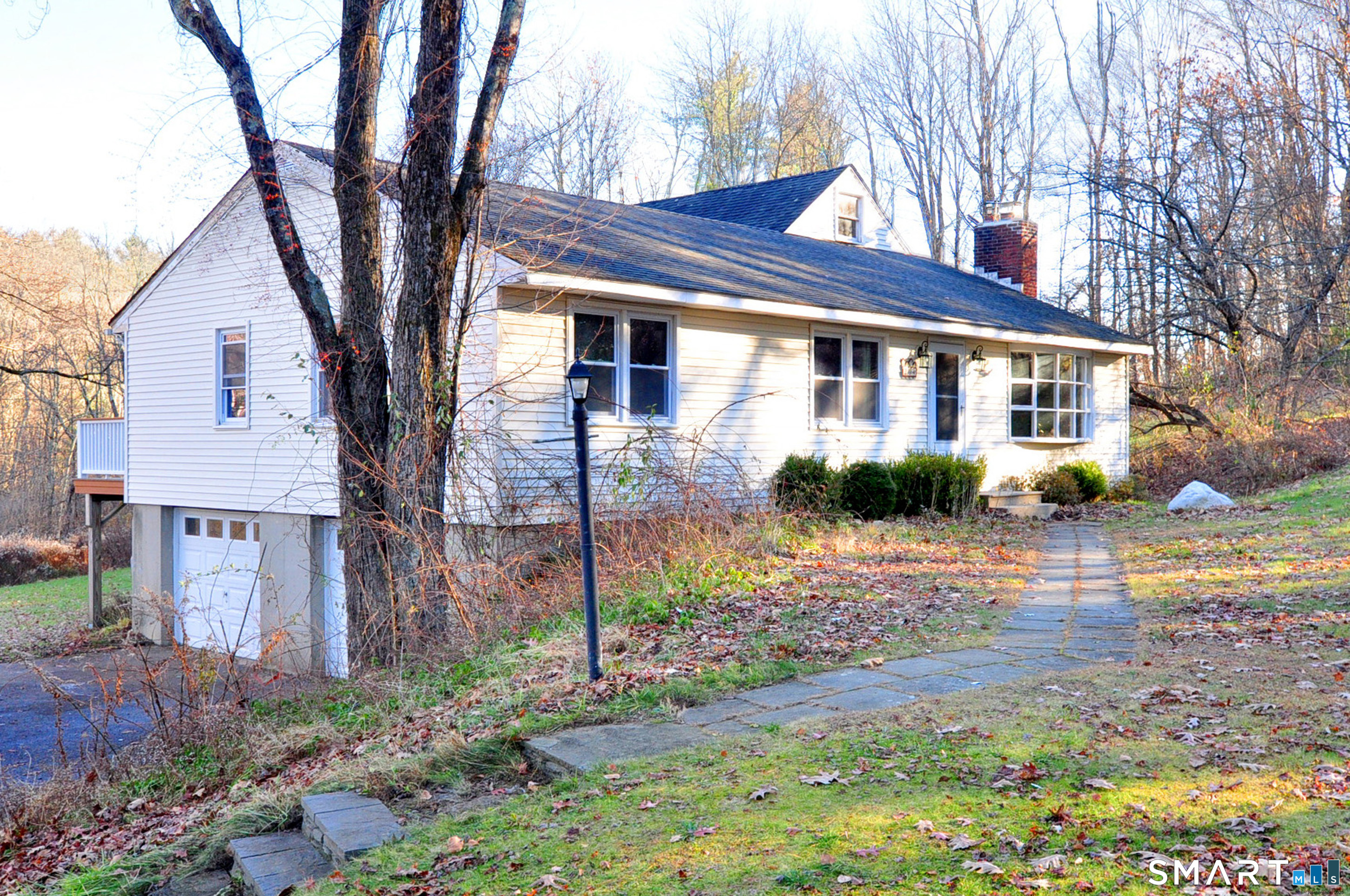 204 Goodhouse Road Litchfield, CT 06759 - Photo 5 of 37 a front view of a house with garden