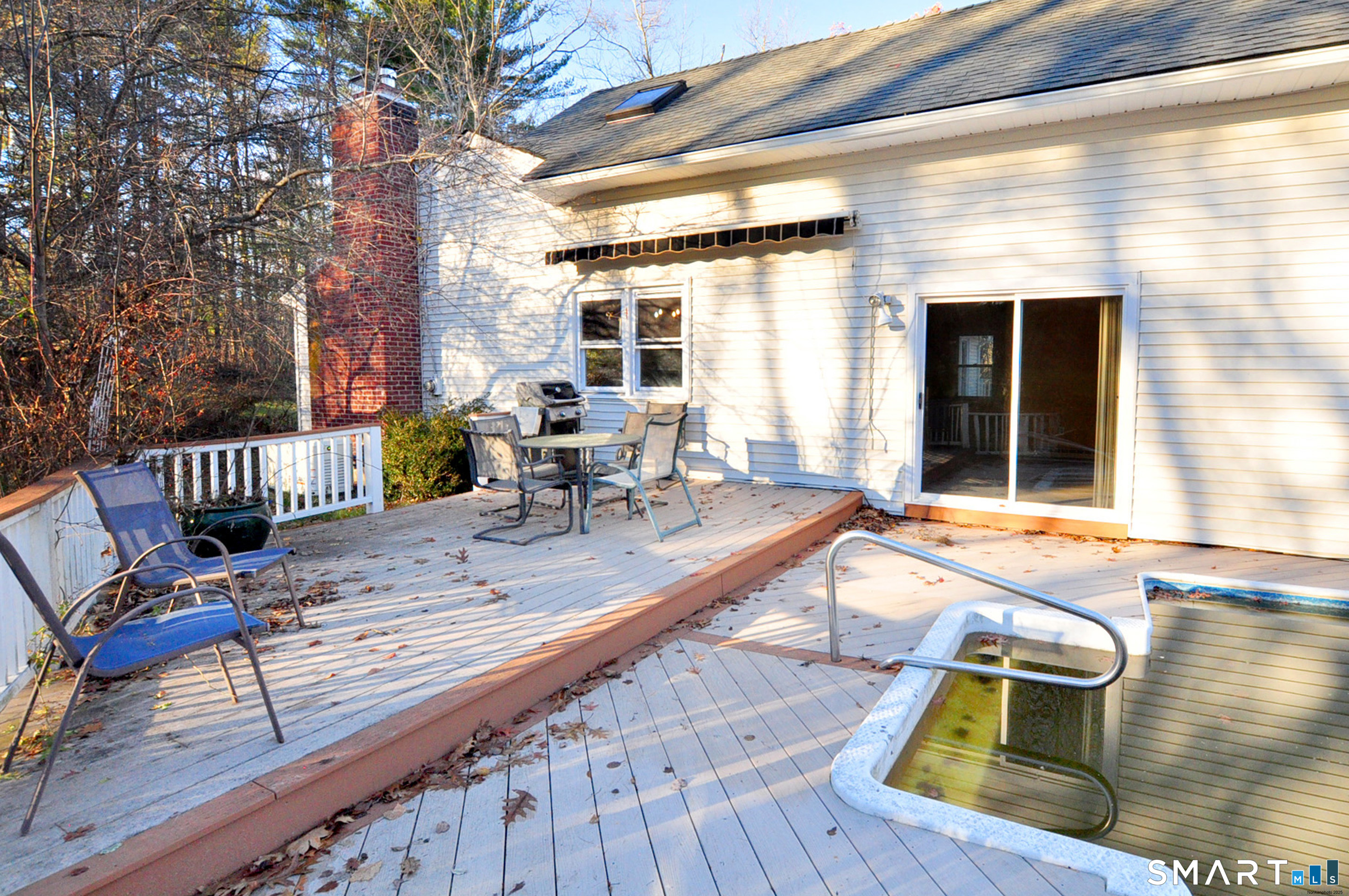 204 Goodhouse Road Litchfield, CT 06759 - Photo 9 of 37 a view of a patio with table and chairs with wooden floor and fence