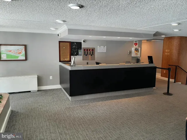 a lobby with furniture and window