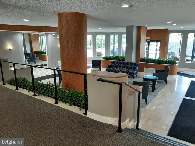 a view of wooden floor and windows in a room