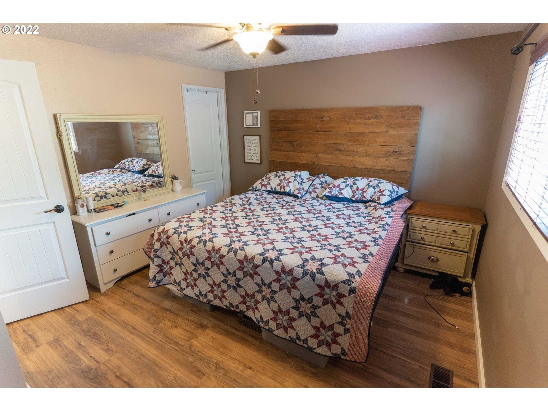 39400 Idleman Street Sandy, OR 97055 - Photo 11 of 15 a bed sitting in a bedroom next to a window