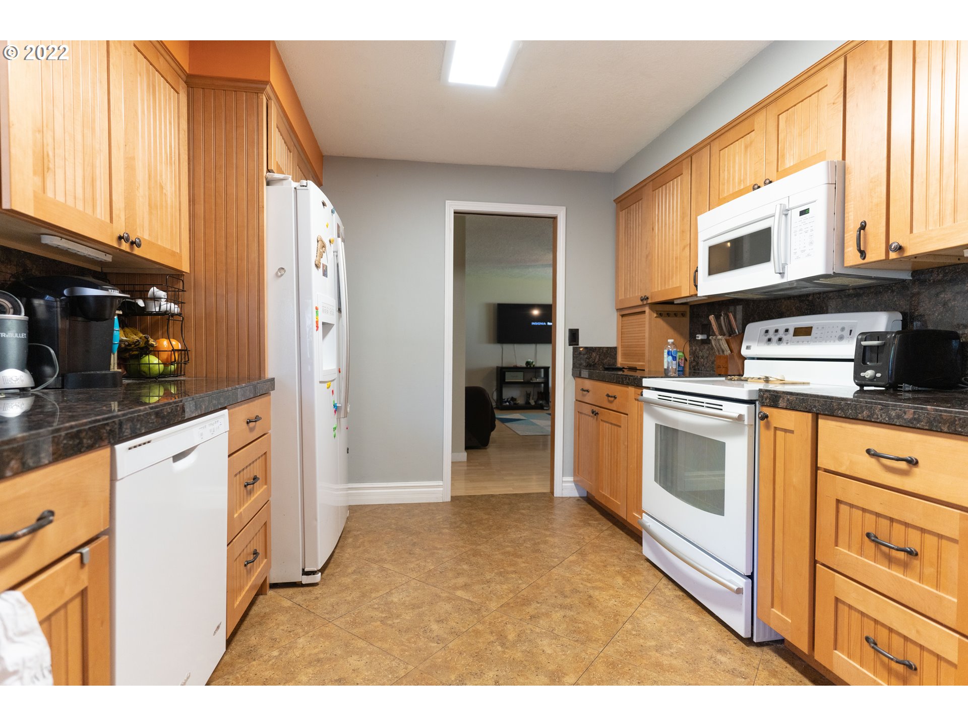 39400 Idleman Street Sandy, OR 97055 - Photo 2 of 15 a kitchen with stainless steel appliances granite countertop a stove a sink and a refrigerator