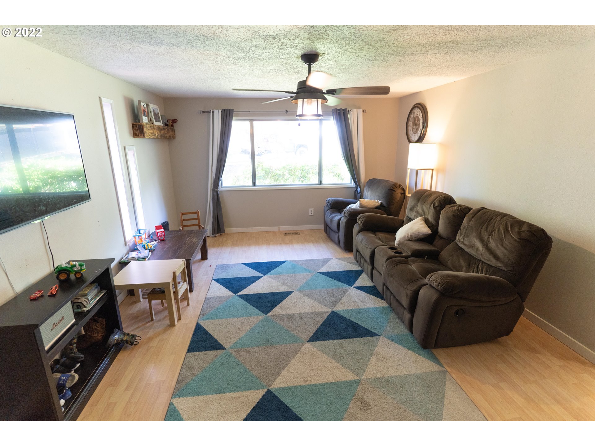 39400 Idleman Street Sandy, OR 97055 - Photo 5 of 15 a living room with furniture and a flat screen tv