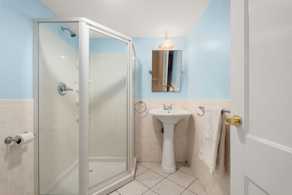 39 Lothrop Street, Unit 1 Boston, MA 02135 - Photo 18 of 19 a bathroom with a shower and a sink