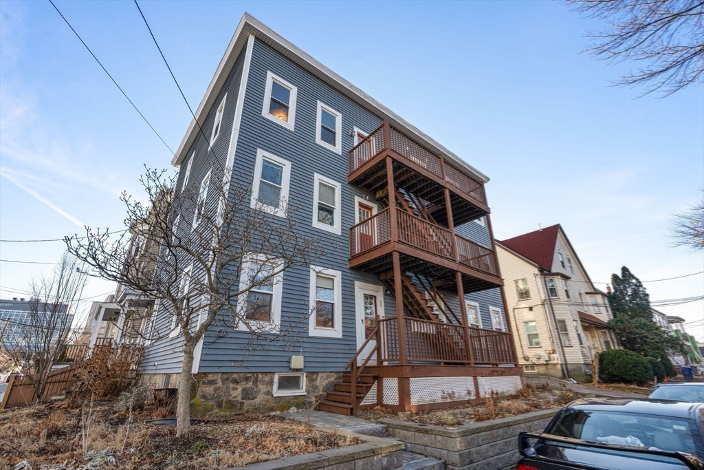 39 Lothrop Street, Unit 1 Boston, MA 02135 - Photo 7 of 19 a front view of a house with garden