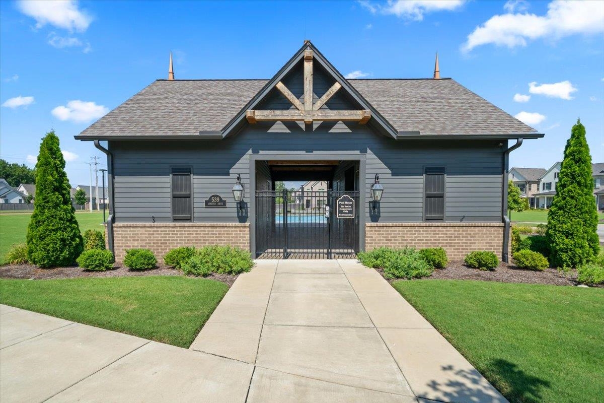467 Armel Drive Collierville, TN 38017 - Photo 30 of 37 a front view of a house with a yard and garage
