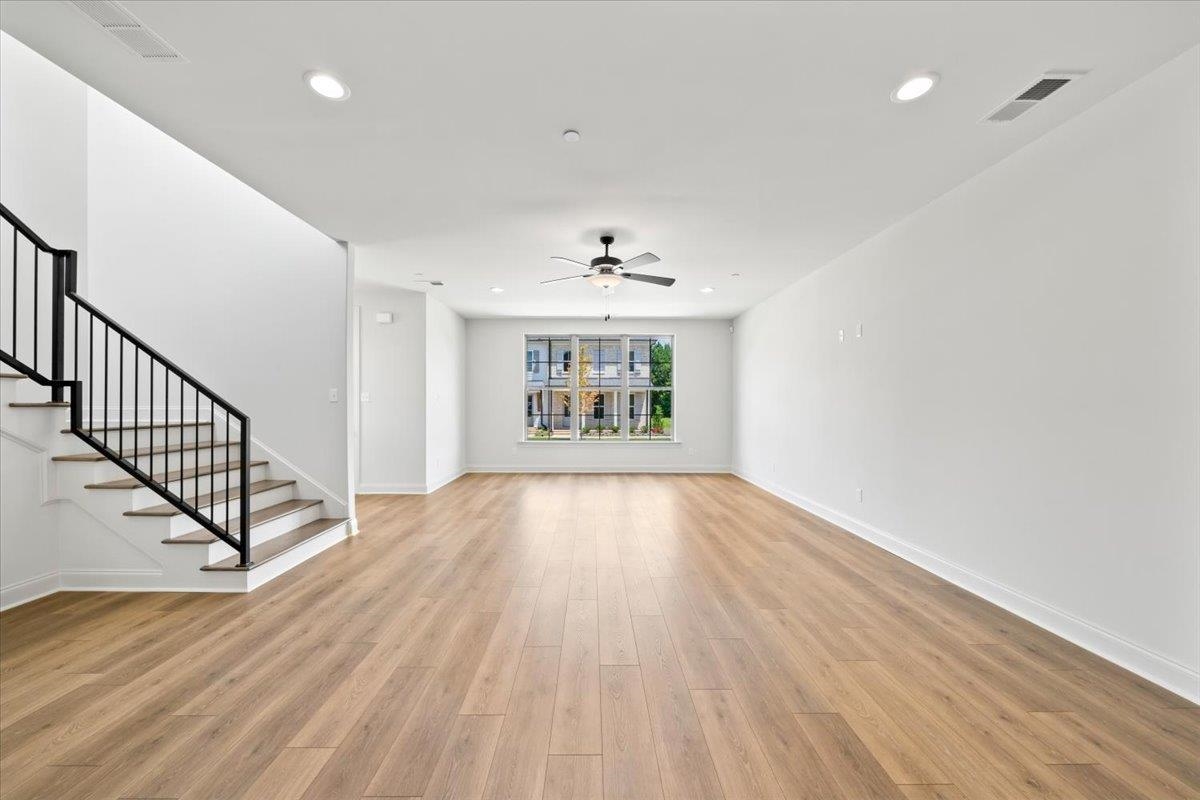 467 Armel Drive Collierville, TN 38017 - Photo 6 of 37 wooden floor in an empty room with a window