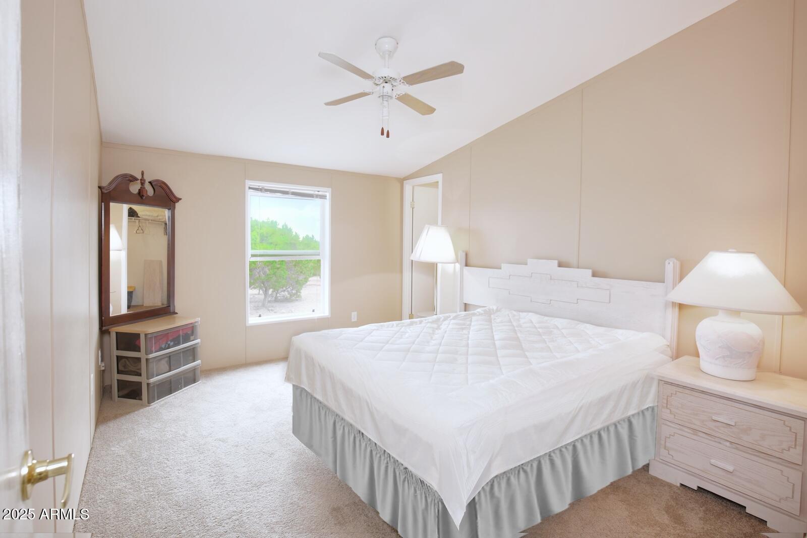 7865 Christmas Tree Road Show Low, AZ 85901 - Photo 11 of 32 a bedroom with a bed a window and dresser