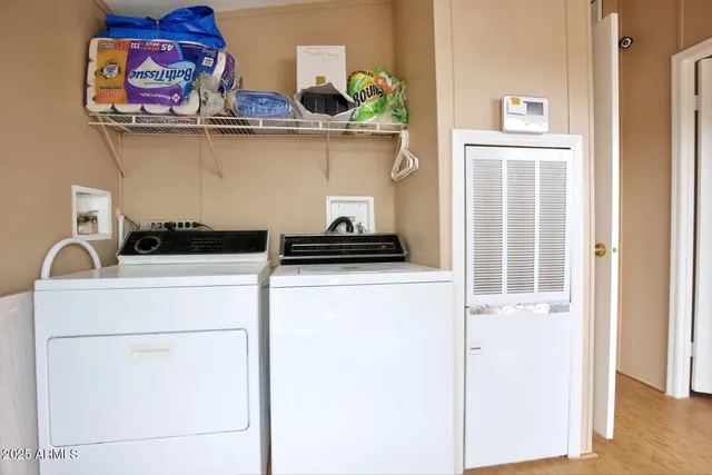 a close view of a utility room with washer and dryer