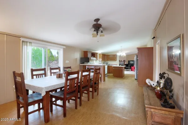 a view of a dining room with furniture window and outside view
