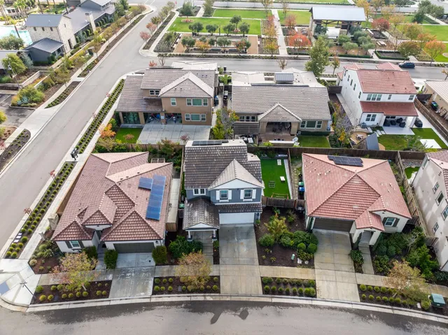 an aerial view of houses with yard