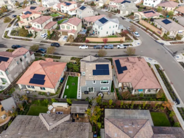 an aerial view of a house with a ocean view