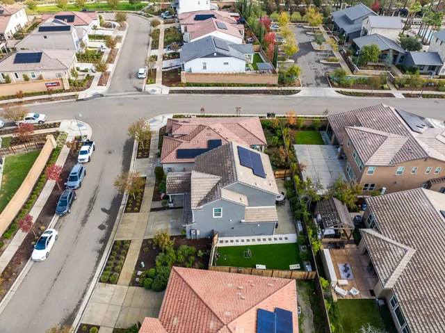 an aerial view of residential houses with outdoor space