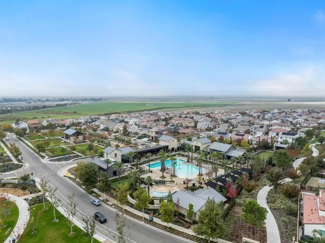 an aerial view of a house with a lake view