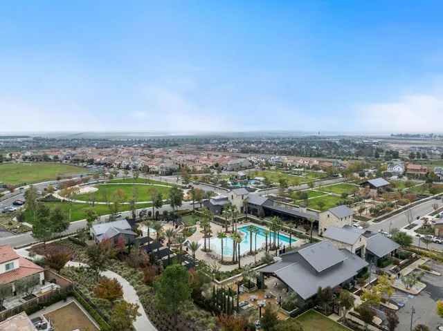 an aerial view of a resort with swimming pool
