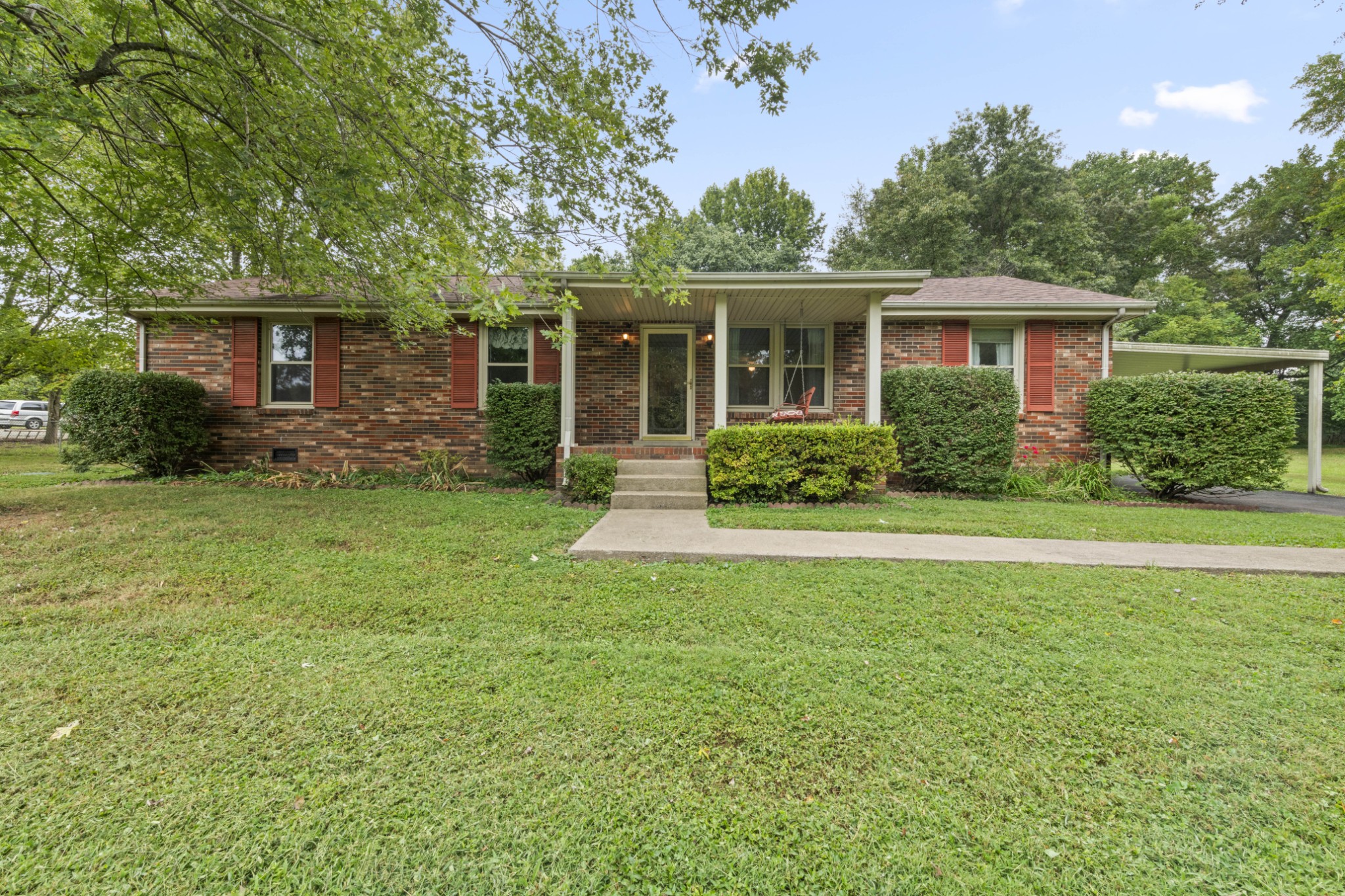 357 Raymond Hodges Road Cottontown, TN 37048 - Photo 1 of 21 a front view of a house with a garden