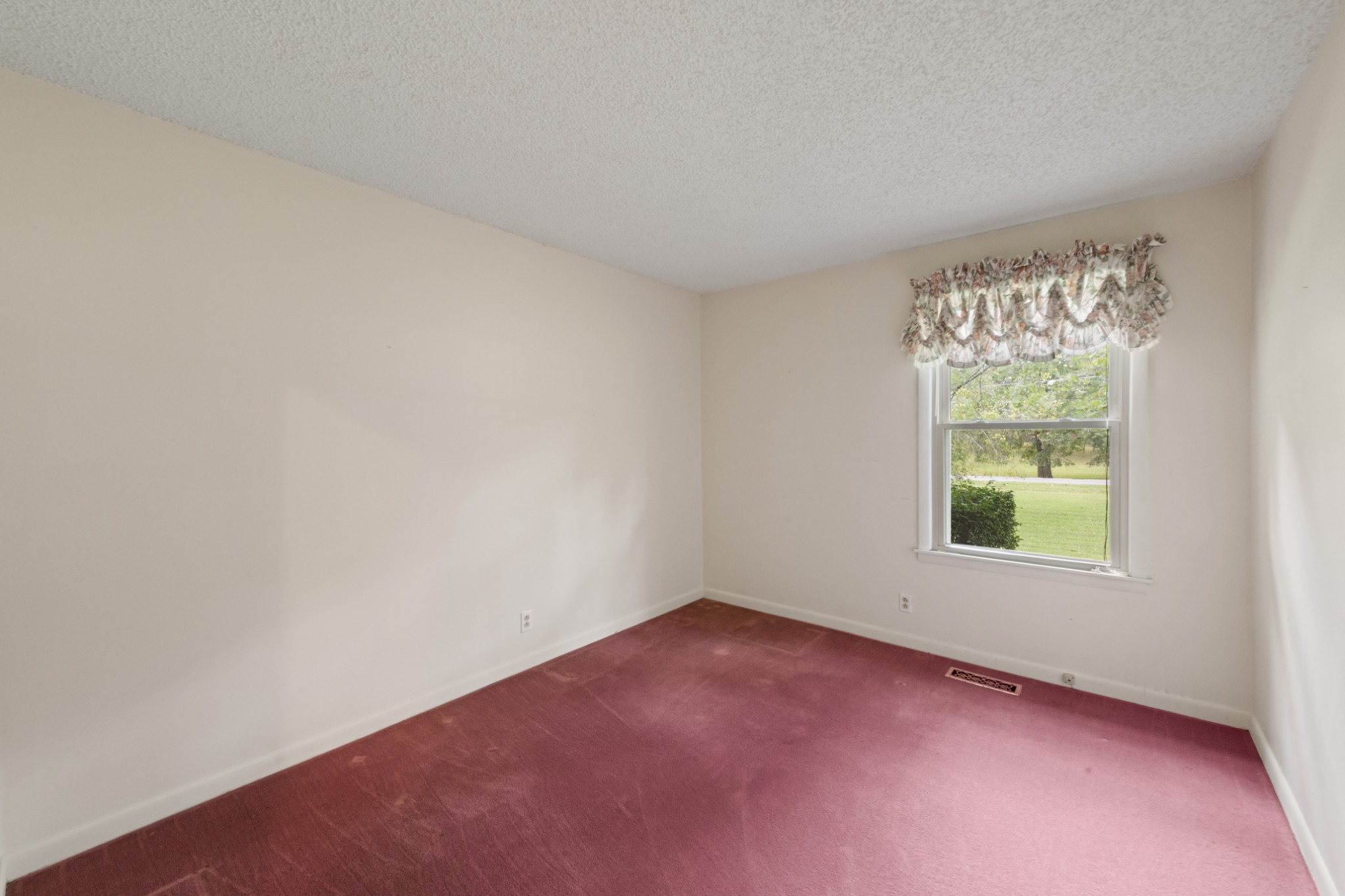 357 Raymond Hodges Road Cottontown, TN 37048 - Photo 12 of 21 an empty room with a window