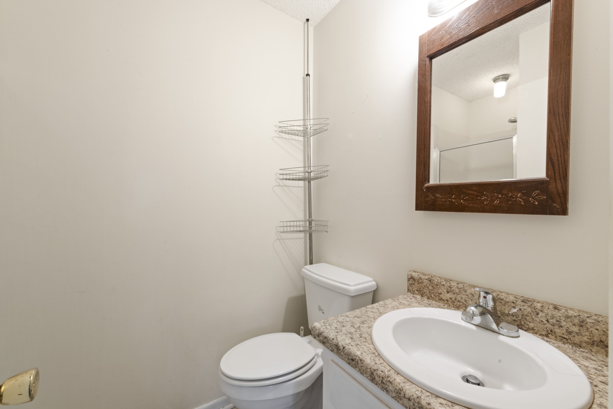 357 Raymond Hodges Road Cottontown, TN 37048 - Photo 13 of 21 a bathroom with a toilet a sink and mirror