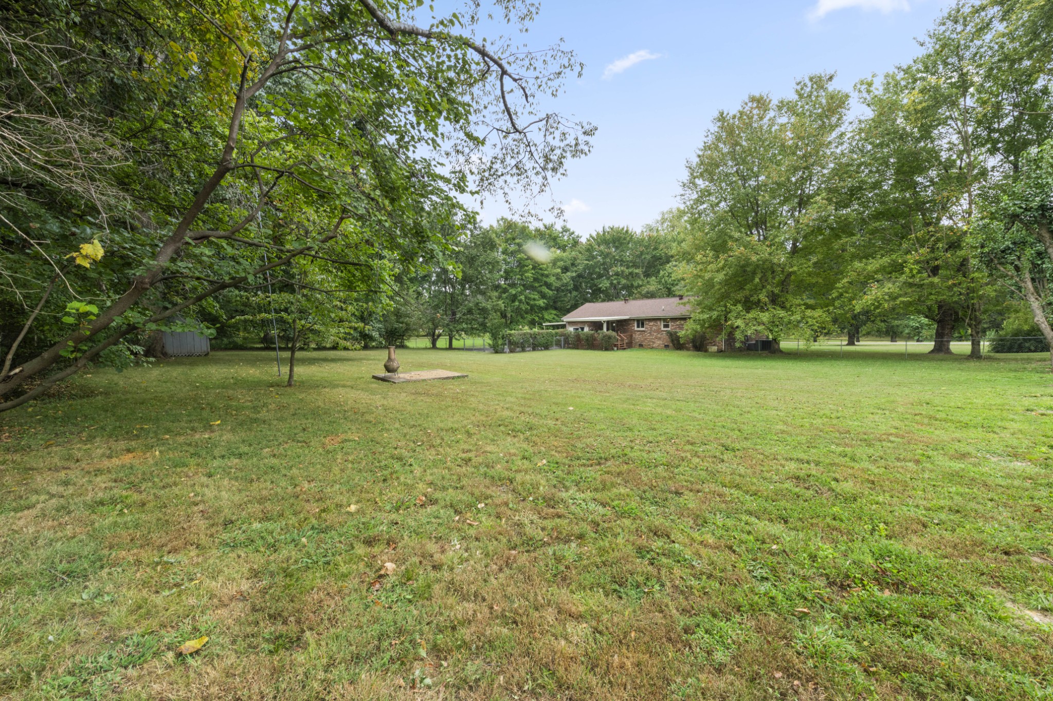 357 Raymond Hodges Road Cottontown, TN 37048 - Photo 20 of 21 a view of a green field with trees in the background